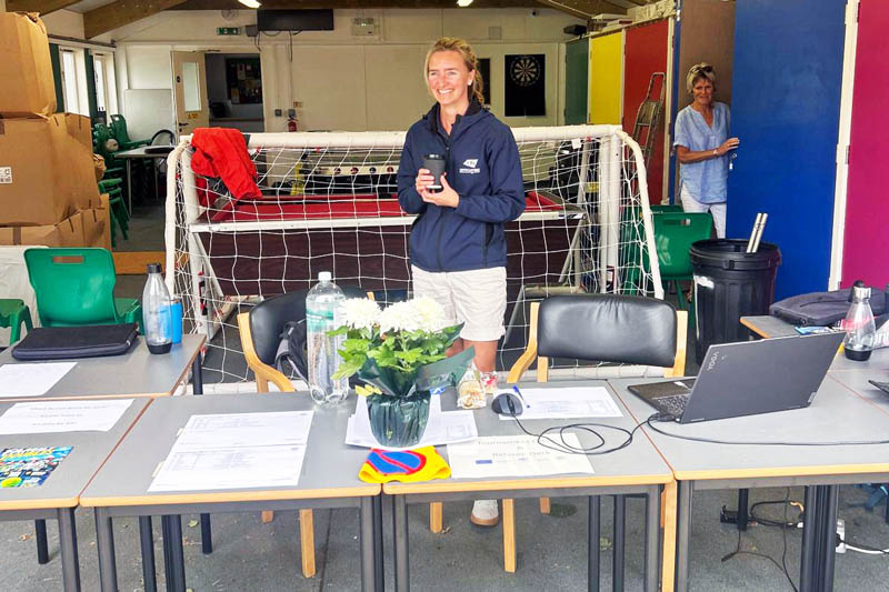 A volunteer at the tournament hub during Open Regatta 2026